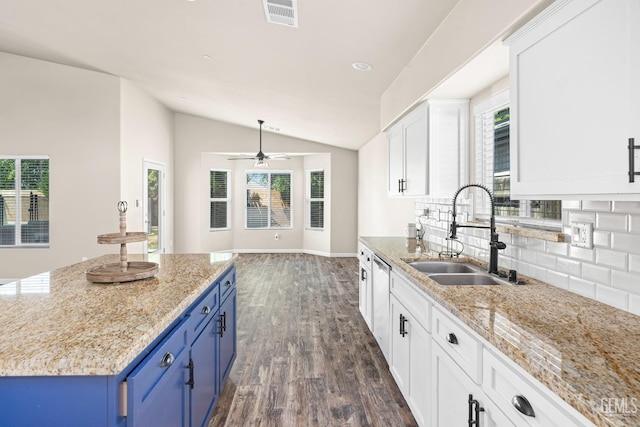 15020 Cotton Blossom Ave, Bakersfield, CA 93314 - kitchen featuring a sink, blue cabinets, vaulted ceiling, dark wood-type flooring, and decorative backsplash