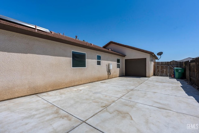 15020 Cotton Blossom Ave, Bakersfield, CA 93314 - view of home's exterior with stucco siding, fence, concrete driveway, and an attached garage