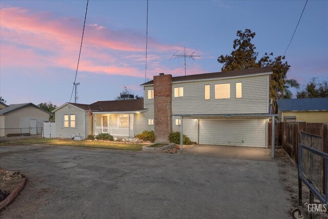 13754 Rosedale Hwy, Bakersfield, CA 93314 - view of front of home featuring a garage and a porch
