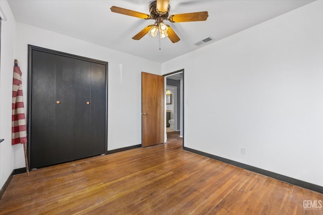 13754 Rosedale Hwy, Bakersfield, CA 93314 - unfurnished bedroom with wood-type flooring, ceiling fan, and a closet