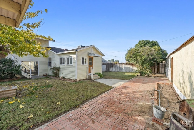 13754 Rosedale Hwy, Bakersfield, CA 93314 - view of property exterior featuring a patio and a lawn