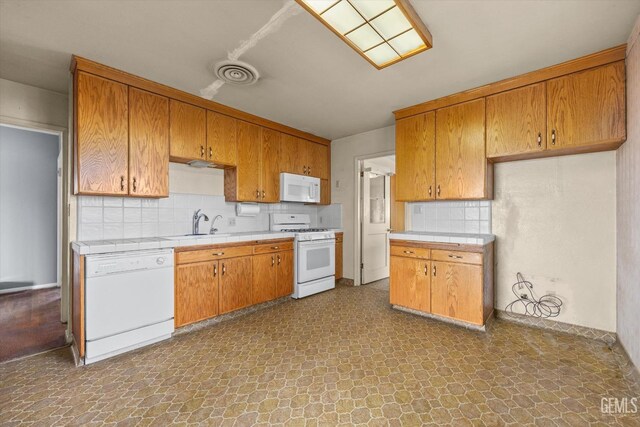 13754 Rosedale Hwy, Bakersfield, CA 93314 - kitchen featuring tasteful backsplash, sink, and white appliances