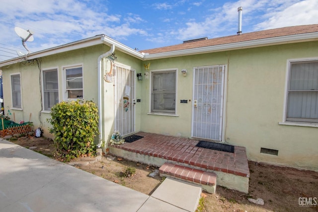 property entrance with a patio area