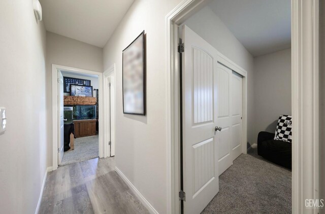 8317 Littleton St, Bakersfield, CA 93314 - corridor featuring wood finished floors and baseboards