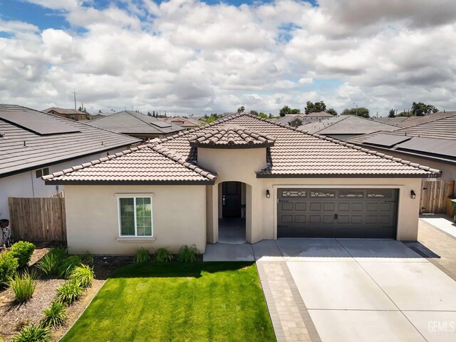 8317 Littleton St, Bakersfield, CA 93314 - mediterranean / spanish-style house featuring fence, a garage, and stucco siding