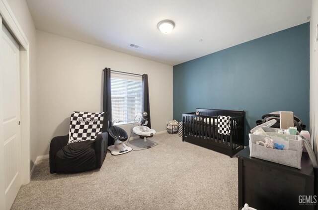8317 Littleton St, Bakersfield, CA 93314 - carpeted bedroom with a nursery area, visible vents, and baseboards