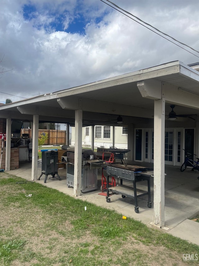 view of patio with ceiling fan and area for grilling