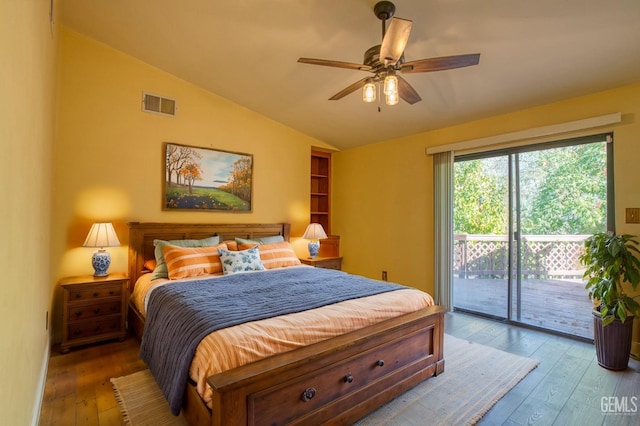 bedroom with hardwood / wood-style flooring, ceiling fan, access to exterior, and vaulted ceiling