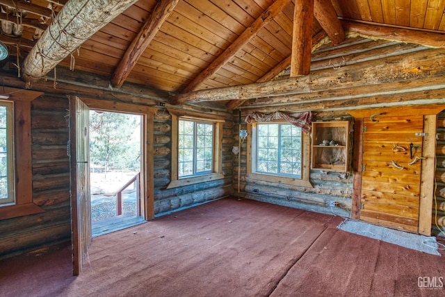 interior space featuring wood ceiling, a healthy amount of sunlight, and lofted ceiling with beams