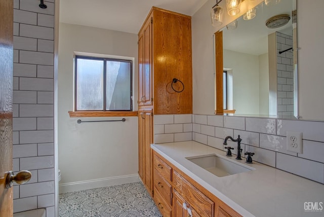 bathroom featuring backsplash, tile patterned floors, vanity, and toilet