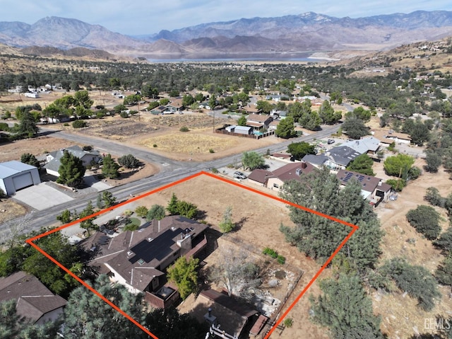 birds eye view of property with a mountain view