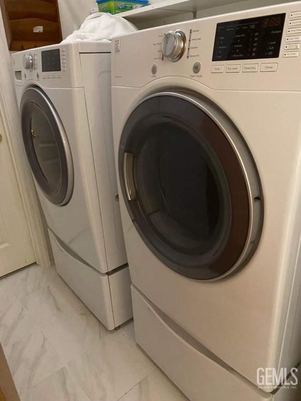 washroom with separate washer and dryer