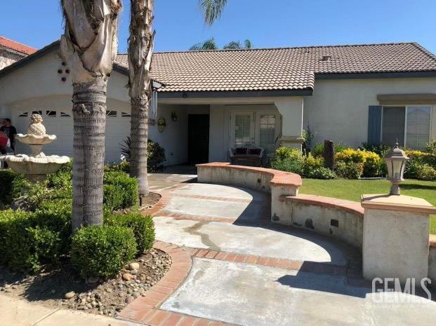 back of house featuring a garage