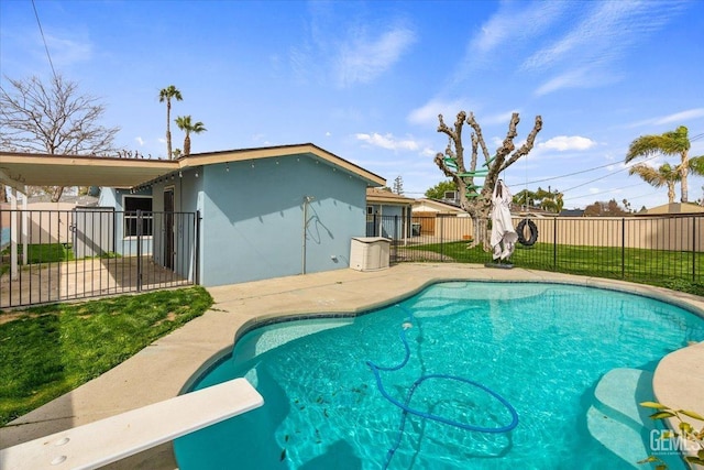 view of swimming pool featuring a patio area, fence private yard, and a fenced in pool