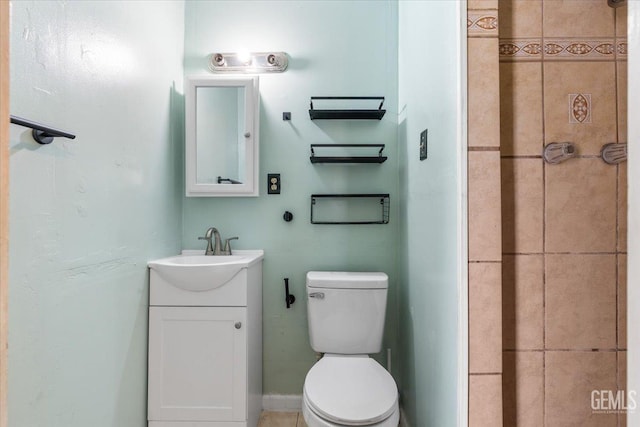 bathroom featuring toilet and vanity