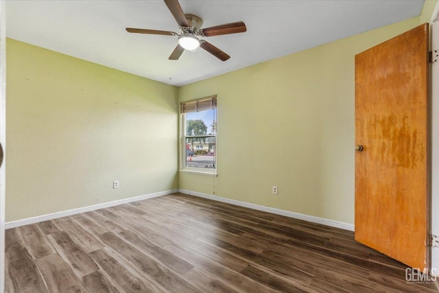 unfurnished room with ceiling fan, baseboards, and wood finished floors