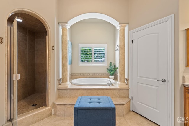 2801 Trengate Way, Bakersfield, CA 93311 - bathroom with ornate columns, a bath, a shower stall, and tile patterned flooring