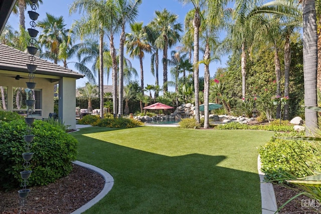 2801 Trengate Way, Bakersfield, CA 93311 - view of grassy yard featuring a pool and ceiling fan