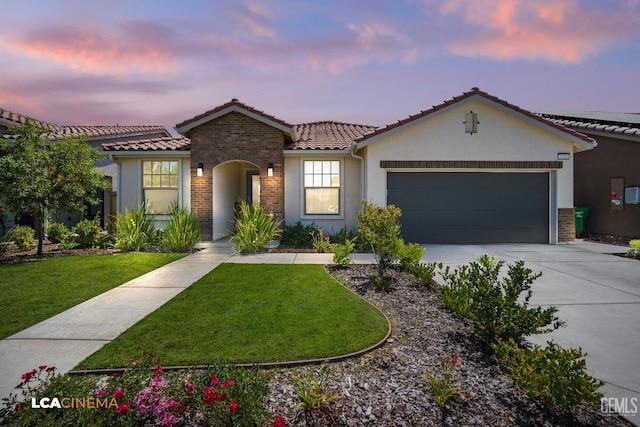 3312 Whispering Brook Ln, Shafter, CA 93263 - mediterranean / spanish-style house featuring a tiled roof, a front yard, driveway, a garage, and stucco siding