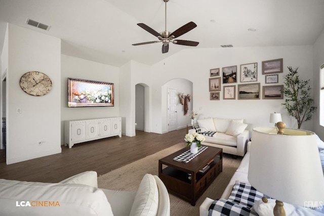 3312 Whispering Brook Ln, Shafter, CA 93263 - living area featuring arched walkways, wood finished floors, vaulted ceiling, and a ceiling fan