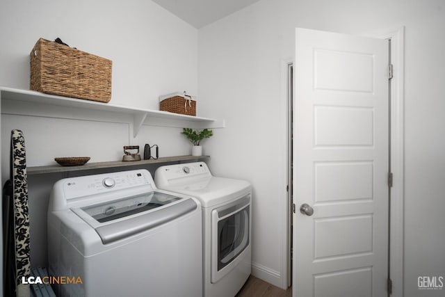 3312 Whispering Brook Ln, Shafter, CA 93263 - laundry room with washer and clothes dryer and wood finished floors