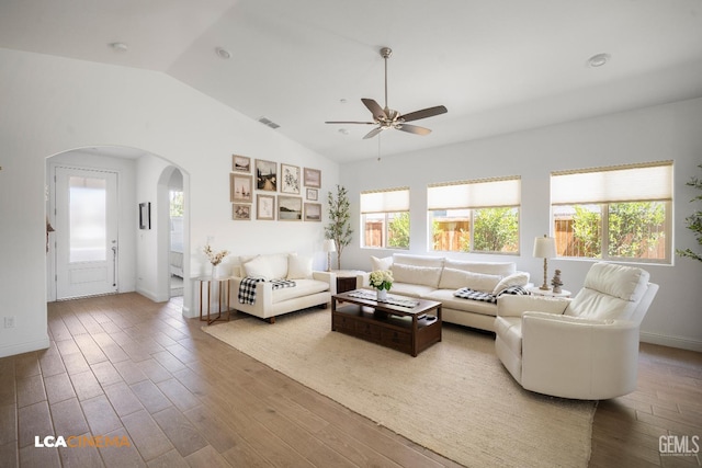 3312 Whispering Brook Ln, Shafter, CA 93263 - living room with arched walkways, plenty of natural light, lofted ceiling, ceiling fan, and wood finished floors