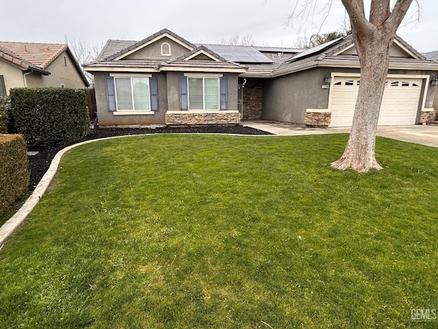 single story home featuring a garage, a front lawn, and solar panels