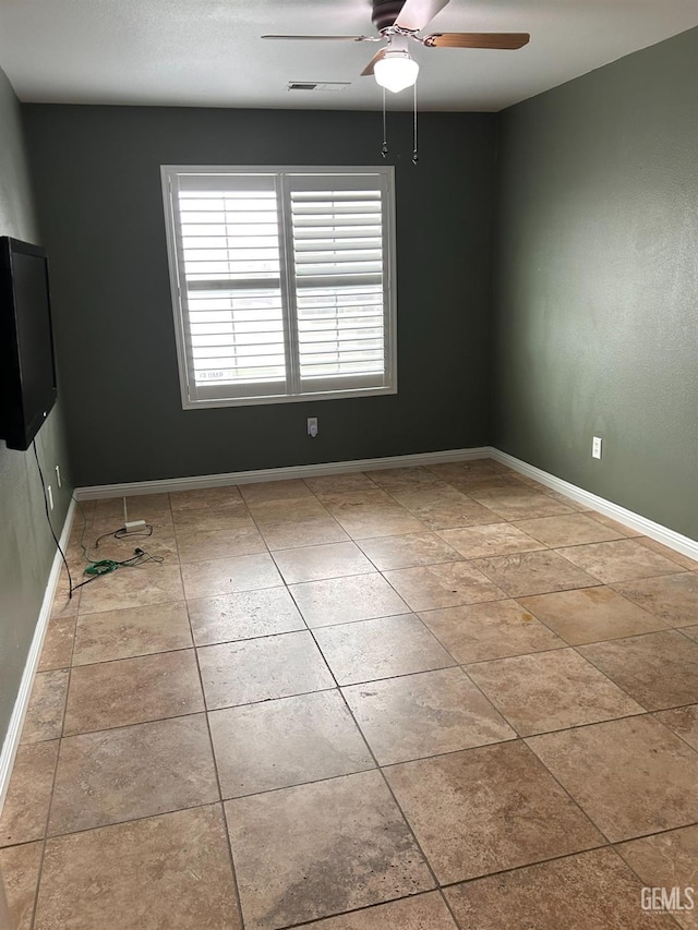 unfurnished room featuring ceiling fan