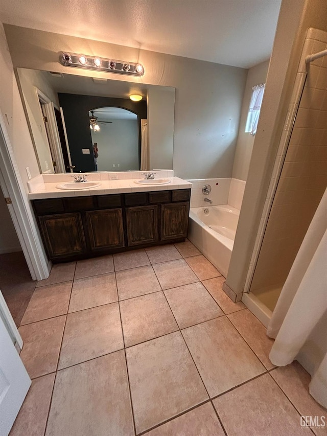 bathroom with vanity, shower with separate bathtub, tile patterned floors, and ceiling fan