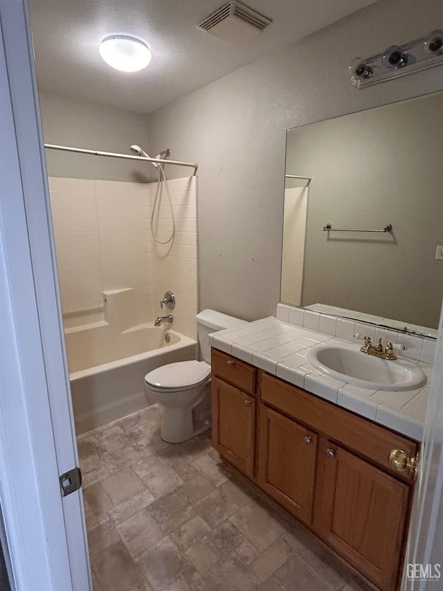 full bathroom with shower / bathtub combination, vanity, and toilet