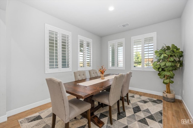 dining area featuring light wood-type flooring