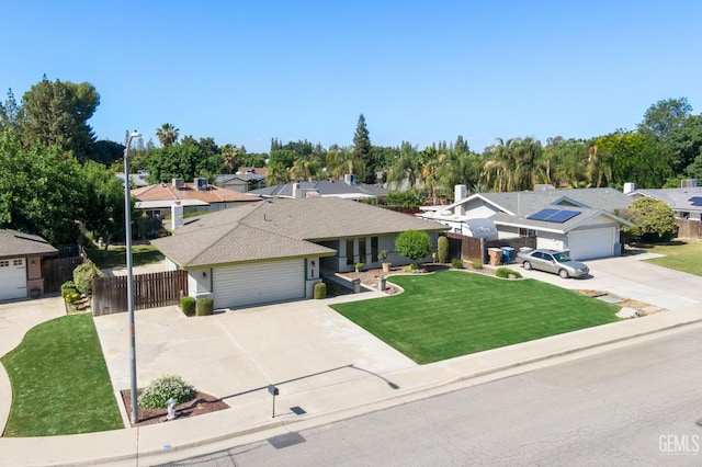 single story home featuring driveway, a residential view, and a garage