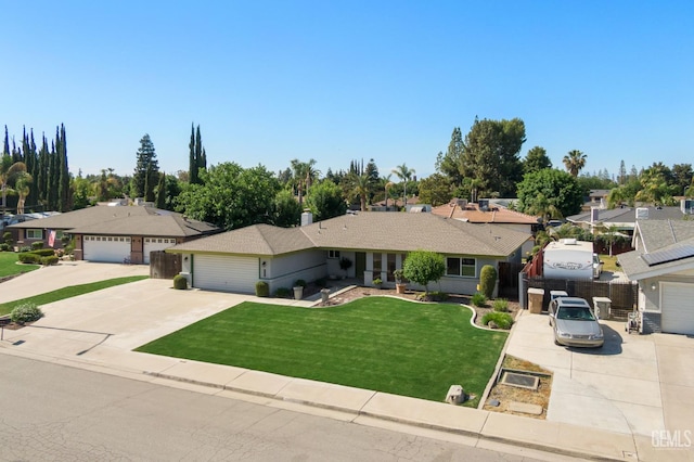 ranch-style home with concrete driveway, a garage, and a residential view