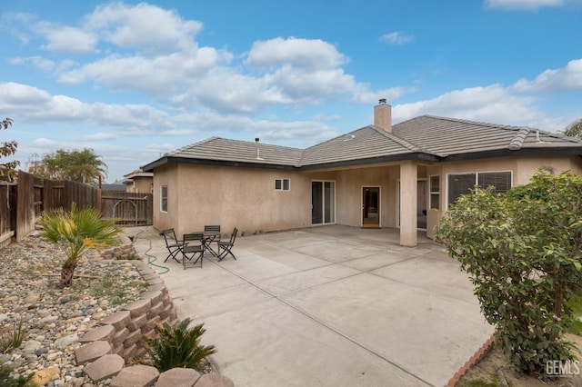 rear view of house featuring a patio