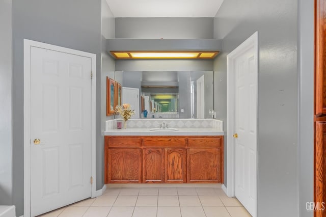 bathroom featuring tile patterned flooring and vanity