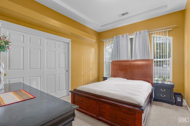 carpeted bedroom with a closet