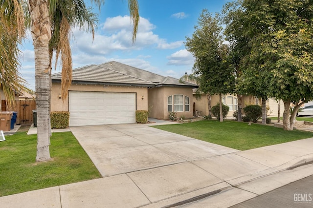 single story home featuring a garage and a front lawn