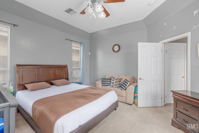 carpeted bedroom featuring ceiling fan and lofted ceiling