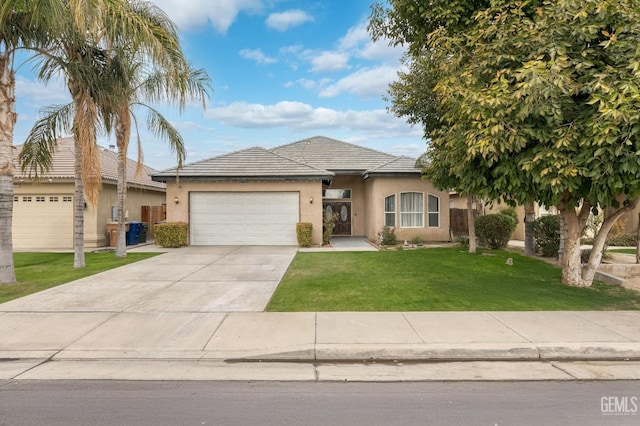 view of front of property featuring a garage and a front lawn