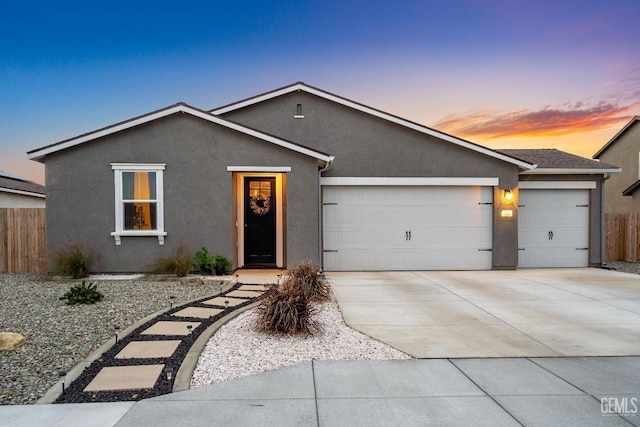 ranch-style home featuring a garage