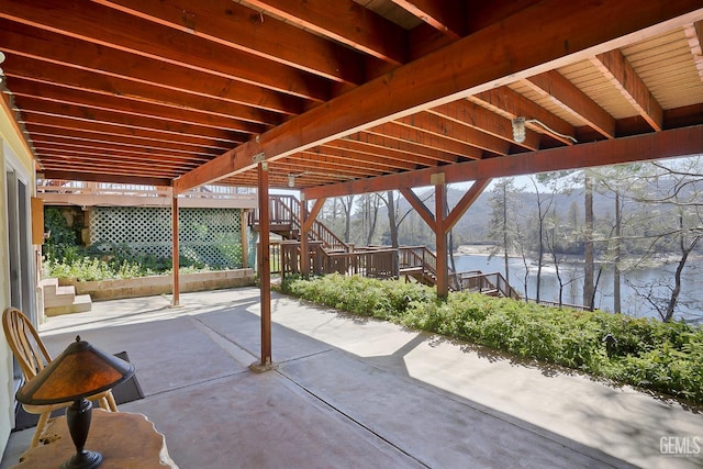 view of patio featuring a water view