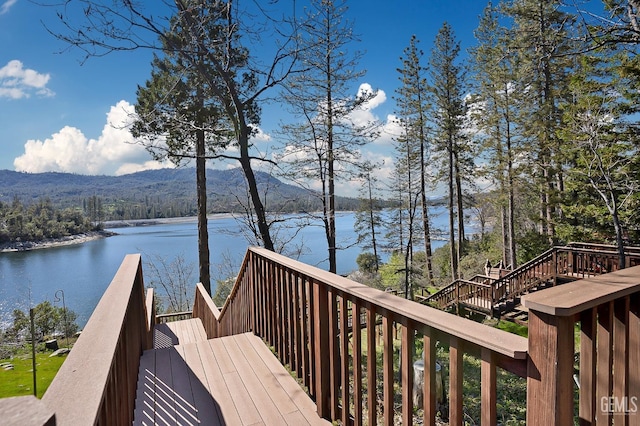 deck featuring a water and mountain view