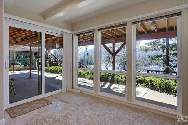 doorway to outside featuring tile patterned flooring