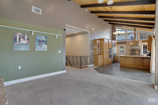 interior space with beamed ceiling, a notable chandelier, wood ceiling, and high vaulted ceiling