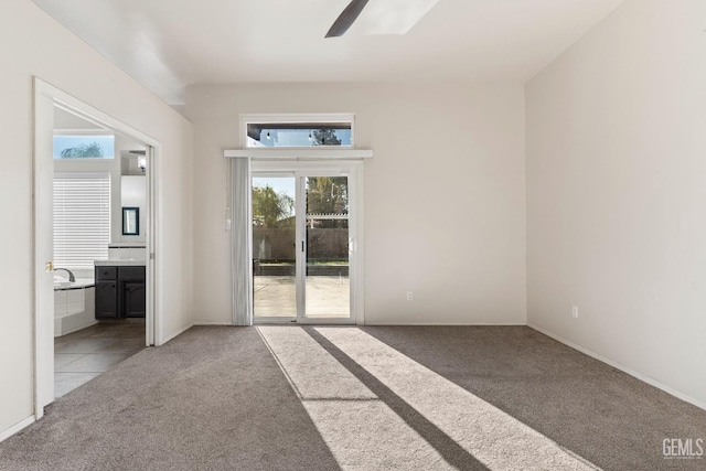 empty room with ceiling fan and light colored carpet