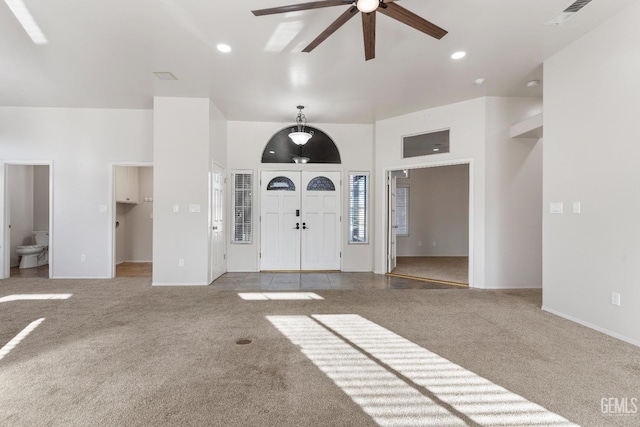 entryway with ceiling fan, recessed lighting, carpet flooring, visible vents, and baseboards