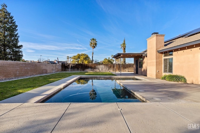 view of pool featuring a fenced backyard, a lawn, a fenced in pool, and a patio