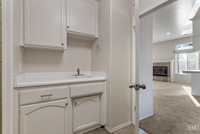 interior space with a fireplace and a sink