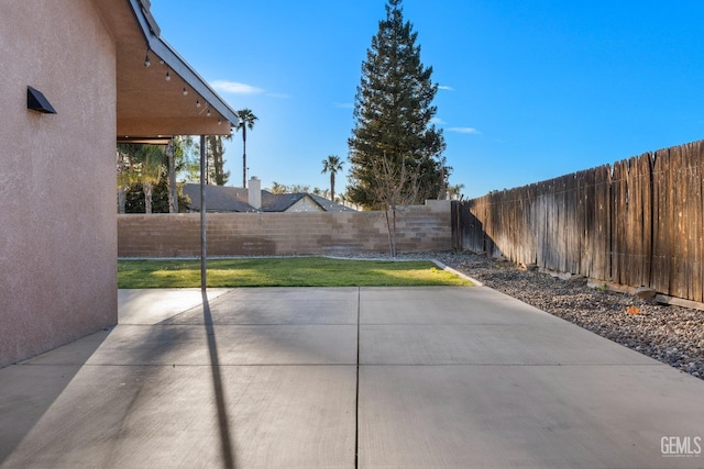 view of patio with a fenced backyard