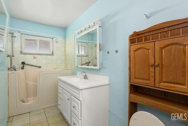 bathroom with tile patterned floors, a shower, a bath, and vanity